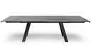 A modern rectangular dining table with a dark gray wood-look top and black angled metal legs, shown on a white background with a soft shadow.