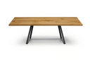 A rectangular wooden dining table with a light oak finish and a black metal A-frame base, shown against a plain white background.
