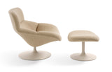 Beige armchair and ottoman on a white background