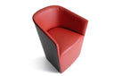 A modern barrel-style armchair upholstered in red leather, featuring a dark side panel, shown from an elevated angle on a white background.