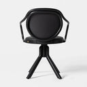 A modern black swivel chair with a circular backrest, integrated side armrests, and a three-star base, shown against a plain light gray background.