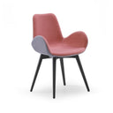 A modern dining chair with a dusty rose pink upholstered seat and curved back, a light gray side accent, and four tapered black legs, shown on a white background.