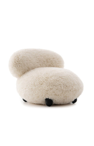 White fluffy chair with black accents on a white background