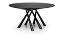 A modern round dining table with a dark wood grain top and a black metal tripod base, shown on a clean white background.