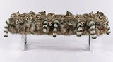 Fur-covered bench with raccoon-like creatures on a white background