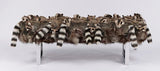 stuffed raccoon covered bench with a metal frame on a white background