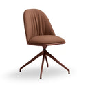 A modern swivel dining chair with a curved, vertically channel-tufted upholstered backrest and seat in a warm brown fabric, supported by a matching dark brown five-star metal base, shown on a plain white background.