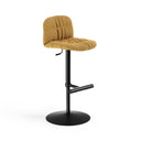 A modern bar stool with a mustard yellow tufted fabric seat and backrest on a black metal pedestal base with a circular footrest, shown on a white background.