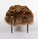 Brown fur ottoman on a white background
