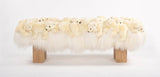 Decorative bench withstuffed polar bears on a white background