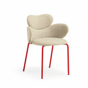 A modern accent chair with a beige textured fabric seat and curved backrest, supported by four slim red metal legs, shown against a plain white background.