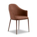 A modern dining chair with a warm brown velvet upholstered seat and curved backrest, supported by slim dark brown wooden legs, shown against a clean white studio background.