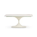 A modern oval dining table with a white marble-patterned top and a sculptural tulip base in a warm off-white finish, shown against a plain white background.