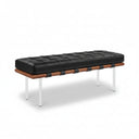 Black leather bench with wooden accents on a white background