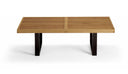A modern rectangular outdoor bench with a light brown slatted wooden top and dark brown block legs, shown on a clean white background.