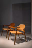 Two Suite AP L CU Lounge Chairs by Midj tan leather and dark wood frame angled from the right
