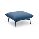 A modern blue ottoman or floor cushion with a textured fabric top and slim metal legs, shown on a plain white background.