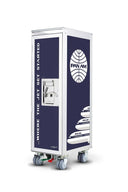 A tall, narrow rolling storage cabinet or utility cart with casters, featuring dark navy blue panels and white graphics. The front panel has vertical text reading 'WHERE THE JET SET STARTED' and a lock, while the side panel shows a large white globe logo with 'PAN AM' inside.