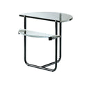 A modern semi-circular corner table with a clear glass top and a curved black metal frame base, featuring a lower clear glass shelf.