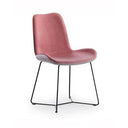 A modern dining chair with a dusty rose pink upholstered seat and backrest, supported by a slim black metal wire frame, shown against a plain white background.
