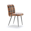 Fasem Avion leather dining chair in tan leather with woven details and black legs, neutral white studio background