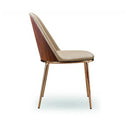 A modern dining chair with a curved backrest, upholstered in beige fabric, featuring a dark brown wood side panel and slim metallic gold legs, shown against a plain white background.