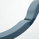 Close detail of curved blue upholstered seat and articulated end of the Luxy Clop Lounge Chair