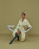 Clop by Luxy shown with alternative perched sitting posture on an expressive patterned fabric design