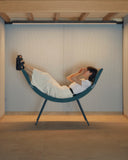 Clop lounge chair by Luxy supporting relaxed reclining posture in blue upholstery