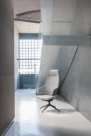 Luxy Italia IT5 high-back four-star executive chair in a modern minimalist interior