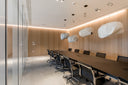 Nulite mesh management chairs around a contemporary meeting table