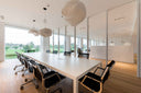 Luxy Nulite mesh chairs at a long modern boardroom table