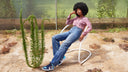 Timeless cantilever chair by Luxy in use, textured upholstery and sculptural white steel frame