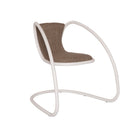 Timeless TS1 cantilever lounge chair by Luxy with taupe upholstered seat and ivory continuous tubular steel frame, studio three-quarter view
