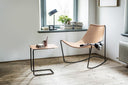 Midj Apelle CT slender metal-framed side table beside an Apelle hide-leather lounge chair by a window