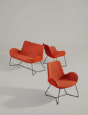 Red upholstered Midj Dalia AP M TS sled-base lounge chairs shown with coordinating Dalia sofa