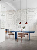 Foil 220x110 Midj dining table in an architectural interior with arched wall design