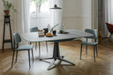 Midj Joe S M CU blue leather dining side chairs with slender metal legs around a dining table in a bright room