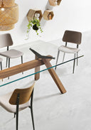 Close-up of Midj Joe S M TS L Side Chairs with light gray seats and a clear glass dining table