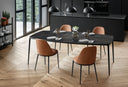 High-resolution Midj Lea S M TS dining chairs in cognac upholstery around a dark dining table