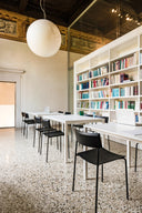 Midj Mito S M LG dining side chairs in a loft dining workspace with long table, bookshelf and high ceiling