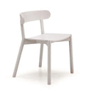 A minimalist light gray wooden dining chair with a curved backrest and tapered legs, shown from a three-quarter angle on a white background.