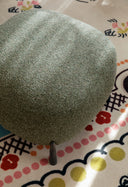 Close-up detail of Midj Mys B1 M TS pouf in textured sage green upholstery