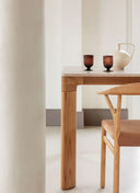 High-resolution Midj Planum wood dining table detail in a sunlit interior