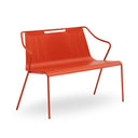 An orange-red metal outdoor bench with armrests and a slatted backrest, shown on a clean white background.