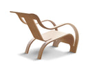 Gerald Summers Bent Plywood Chair a light brown wooden lounge chair with curved arms and legs from a 3 4 view