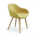 A modern accent chair with a textured mustard yellow upholstered seat and curved backrest, supported by four tapered light wood legs, shown on a white background.