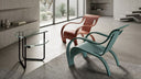 Two Gerald Summers Bent Plywood Chairs by Archilab one light brown and one teal with curved arms and legs