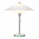 A modern table lamp with a wide white conical shade, a polished silver metal stem, and a round clear glass base, shown on a plain white background.