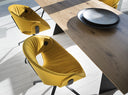 Two Fl t Soft Upholstered Chairs 9W3 01 by Tonon in vibrant yellow velvet with black metal swivel bases flanking a